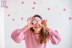 Curitiba Nutritionist Noelle Oliveira Poses Playfully with Heart Shapes Over Eyes. Noelle Oliveira, nutritionist in Curitiba, poses with heart shapes over her eyes for this Lifestyle Business Portrait