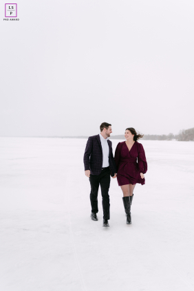 Across the frozen lake in Appleton, this couple walks through winter with smiles untouched by the bitter cold. The vast white space surrounding them gives the photograph simplicity, intimacy, and a wonderfully cinematic sense of isolation.