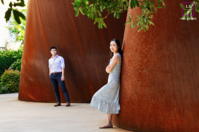 In Palo Alto, the couple stands separated by towering rust-colored sculptures, their quiet distance adding tension and elegance to the frame. The sweeping curves and careful negative space transform a simple portrait into something sculptural and modern.