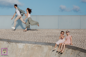 Paris Parents Drift Out of Frame as Daughters Sit Calmly in Unusual Playful Family Portrait In Paris, the parents appear to drift out of the frame while their daughters sit calmly below, almost unimpressed by the escape. The unusual spacing and playful imbalance turn this family portrait into something humorous and wonderfully unexpected.