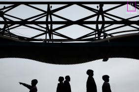 Paris Family Walks in Silhouette Beneath Striking Modern Canopy in a Graphic Minimalist Portrait This Paris family appears in silhouette beneath a striking geometric canopy, each figure separated by posture and gesture. The child pointing adds curiosity and direction, while the minimalist composition transforms an ordinary walk into something graphic