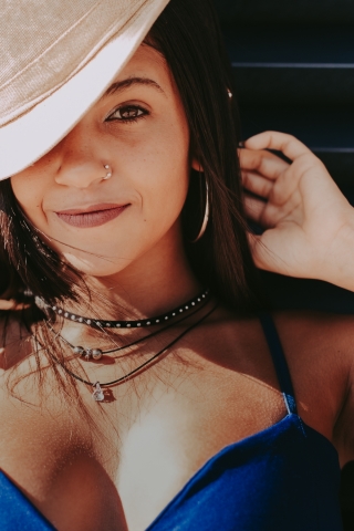 Brazil Face only photo of young woman with hat where only one eye appears in a Rio de Janeiro lifestyle portrait