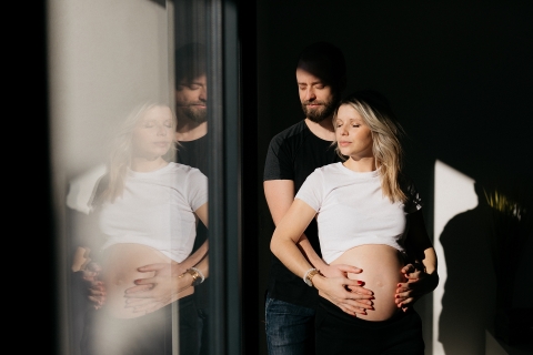 Occitanie Creative Lifestyle light and shadow maternity portrait with glass reflection