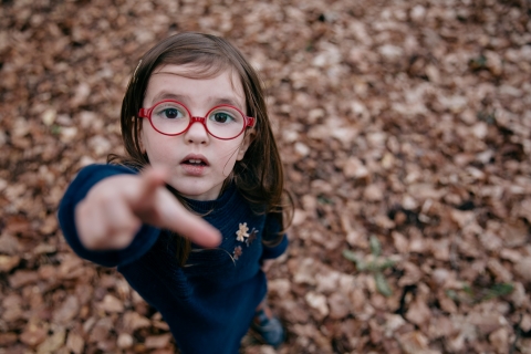 Cote-d'Or Lifestyle Photographer created this artistic portrait of a girl looking for the ladybird