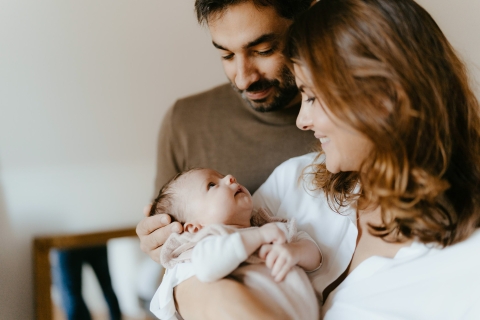 A professional lifestyle family photo from Jura showing a The gaze of love