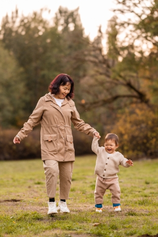 A heartwarming lifestyle portrait captured at Marymoor Park in Redmond, Washington. It showcases the special bond between a doting Grandma and her grandson during a delightful fall outing