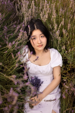 This captivating lifestyle portrait captures a young woman in the picturesque surroundings of Fall City, Washington, basking in the beauty of nature