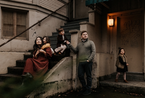 This lifestyle portrait captures an urban couple with their three kids against the backdrop of Portland, Oregon's city scene