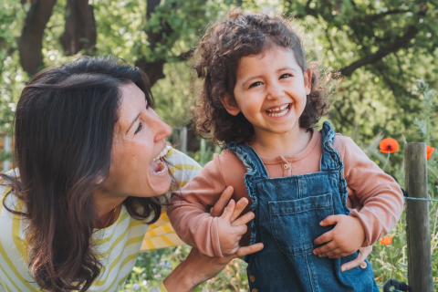 In la Cadiere-d'Azur, Var, PACA, France, a picture was taken of a mom and her young girl laughing happily, capturing a special time for them during a family photo session.