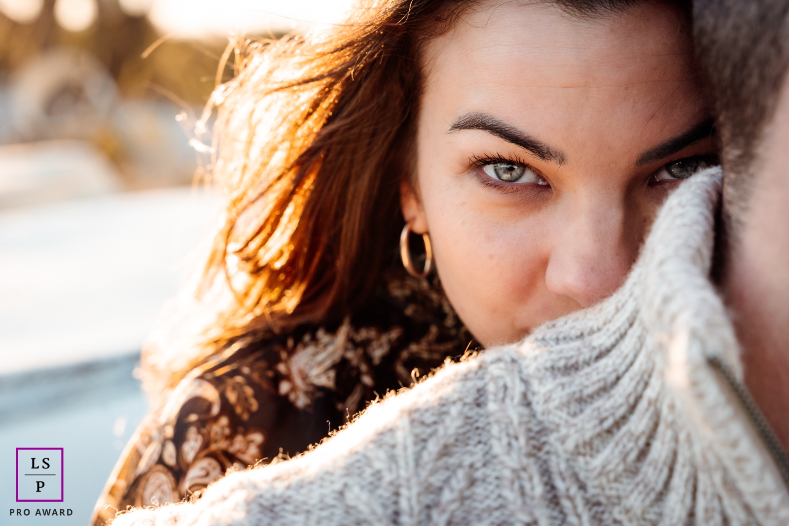 Close up lifestyle portrait of a young woman with her face partially hidden, leaning on her man's shoulder in Montpellier.