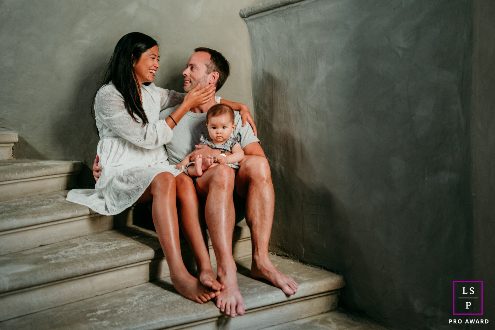 A Herault portrait of family on the stairs at home in Occitania