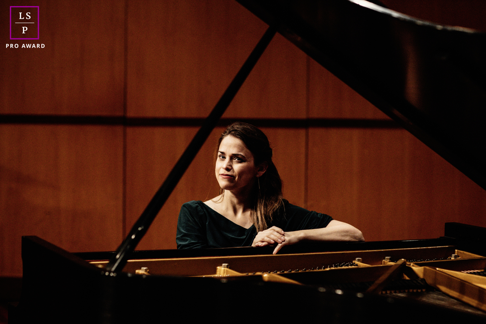 Professional Business Portrait of a Confident Woman Seated at a Grand Piano on Santa Clara University Campus in California. 
