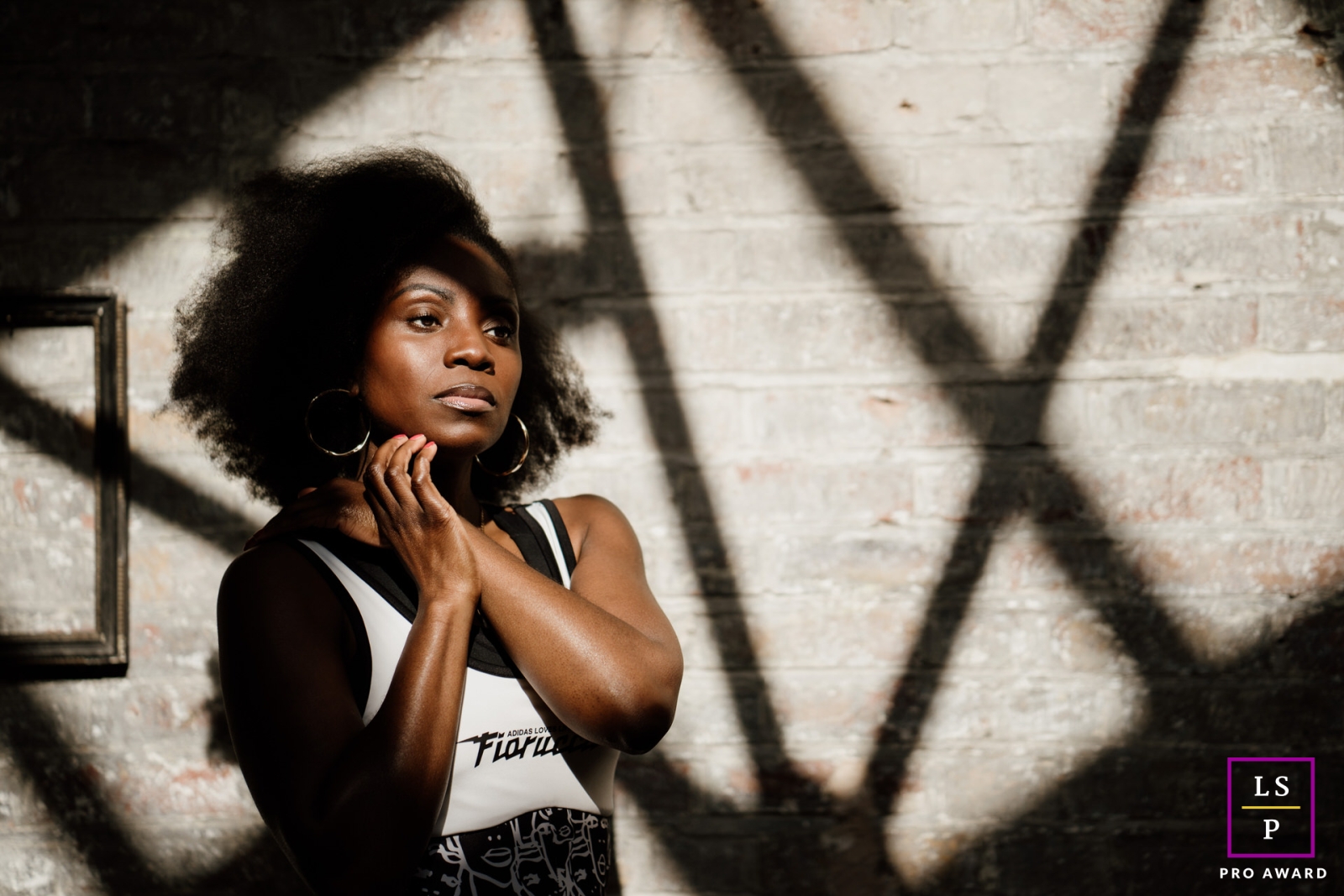 A portrait of Tamu, a Somatic coach in London, England, showcasing her unique movement techniques during a lifestyle business branding session.