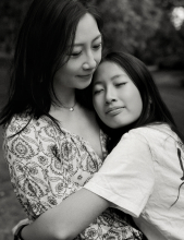 A mother and daughter share a tender embrace with eyes closed during a quiet black and white family moment in Markham.