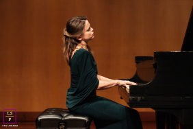 Pianist Gretchen Hull Appears Lost In Warm Stage Light At Piano In San Jose, California Portrait At the piano in San Jose, California, Gretchen Hull appears lost in the music. Warm stage tones, elegant posture, and generous negative space give the portrait the quiet gravity of a live performance.