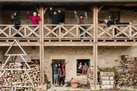 Cousins are spending time together in a chalet in Saint-Christophe-en-Brionnais, Saône et Loire. They are smiling and enjoying each other's company in a candid lifestyle portrait.