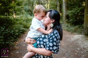 Isère Embrace: Mother And Toddler Share A Tender, Loving Gaze In Isère, France, a mother holds her toddler as they touch foreheads, sharing a tender, loving gaze.