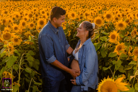 At Colby Farm in Newbury, Massachusetts, a couple celebrates new life among blooming sunflowers, bathed in late-afternoon warmth.