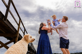 Spontaneous Joy: Family Dance With Dog On Wequasset Beach Shore At Wequasset Beach in Harwich, Massachusetts, parents, children, and their dog share spontaneous joy in a family dance by the shore.