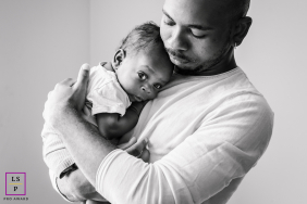 Warm Hug Shared In Black-And-White Lyon Portrait Of Baby And Uncle In Lyon, France, a black-and-white portrait captures a baby sharing a warm hug with his uncle.