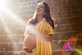 In Curitiba, Brazil, a vibrant, energetic pregnant woman is captured in an artistic shot, radiating the joy of anticipation.