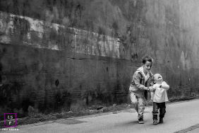 Brother's Sunlit Embrace: A Protective, Heartfelt Moment in Bayonne A protective older brother embracing his younger sibling in a sunlit, heartfelt lifestyle portrait in Bayonne.