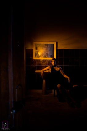A woman in her bathroom is captured in a beautiful, natural lifestyle portrait.
