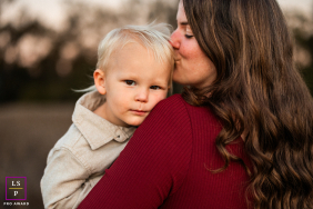 Mom's Loving Kiss: Son Looks At Camera For Santa Barbara Portrait Mom lovingly kisses her son's head as he looks directly into the camera for their Santa Barbara portrait.