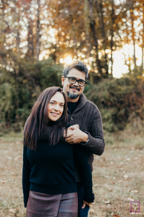 Happy couple in Rockville, MD, smiling as the husband lovingly wraps his arm around his wife.