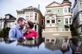 San Francisco couple looking into eyes, with iconic SF homes and reflections. 