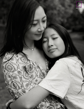Mother And Daughter Share Tender Black And White Embrace In Markham A mother and daughter share a tender embrace with eyes closed during a quiet black and white family moment in Markham.