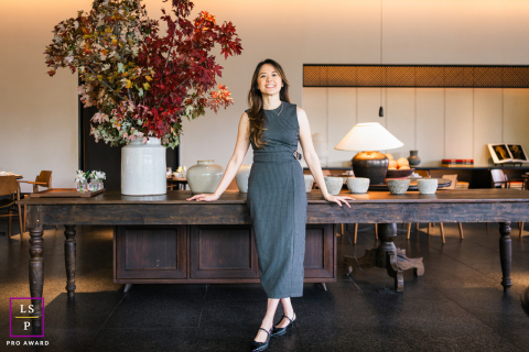 Inside Chengdu Taikoo Li, Admira stands with relaxed confidence among rich wood tones and autumn colors. The wide composition, sculptural details, and warm light create a branding portrait that feels polished, modern, and inviting.