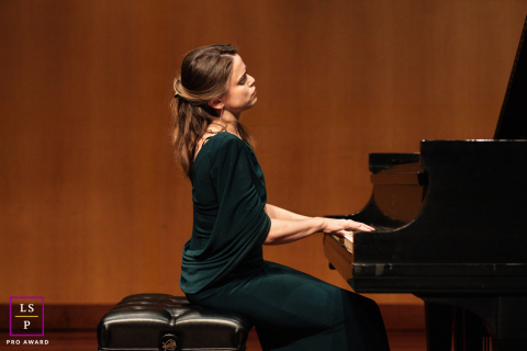 Pianist Gretchen Hull Appears Lost In Warm Stage Light At Piano In San Jose, California Portrait At the piano in San Jose, California, Gretchen Hull appears lost in the music. Warm stage tones, elegant posture, and generous negative space give the portrait the quiet gravity of a live performance.
