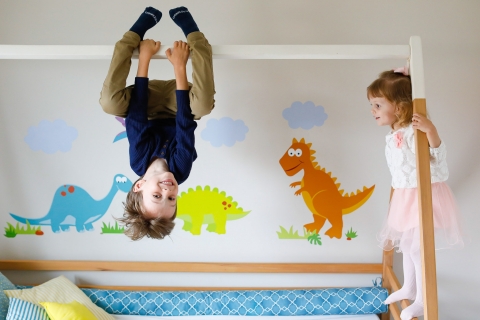 A lifestyle family picture from Parana during a photography session of the brother and sister playing in the room