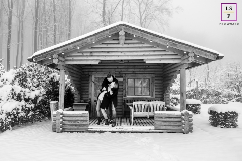 In snowy Warstein, NRW, Germany, a couple poses in front of a charming tiny house for a captivating lifestyle portrait