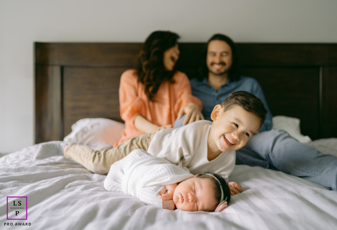 New life, new love, new memories. A candid image captured in the comfort of home with a growing family.