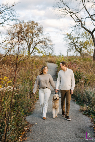 Chicago IL: A warm and loving couple walking in the woods, surrounded by the beauty and tranquility of nature. They share a heartfelt connection and joy in each other's company, captured in this family portrait.