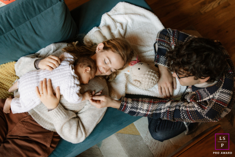 In Chicago, IL, a family of three shares warm cuddles, embodying pure love and togetherness.