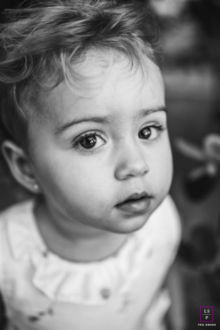 A vertical, black-and-white portrait of Clarice from Maceió-AL. The photo focuses on her eyes.