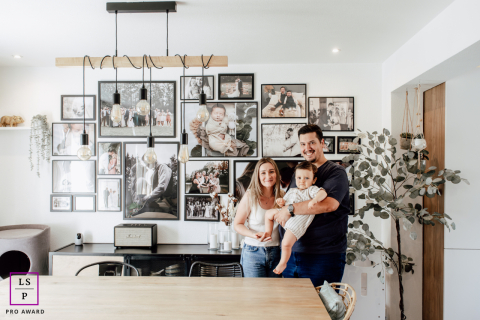 Alsace family of three smiles, posing naturally during a memorable home lifestyle portrait session.