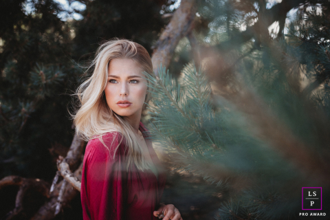 Young woman stands peacefully amidst the heath landscape in Haltern am See, Germany.