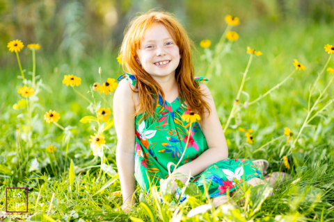 Girl Sitting Peacefully in a Sunny Reno, Nevada Daisy Field Portrait.