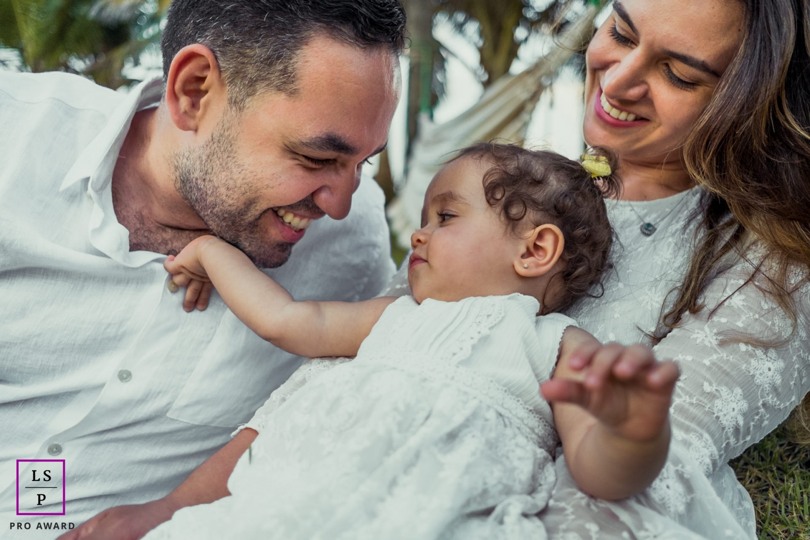 Alagoas Creative Family Lifestyle Portrait image capturing the love of father and baby with mom