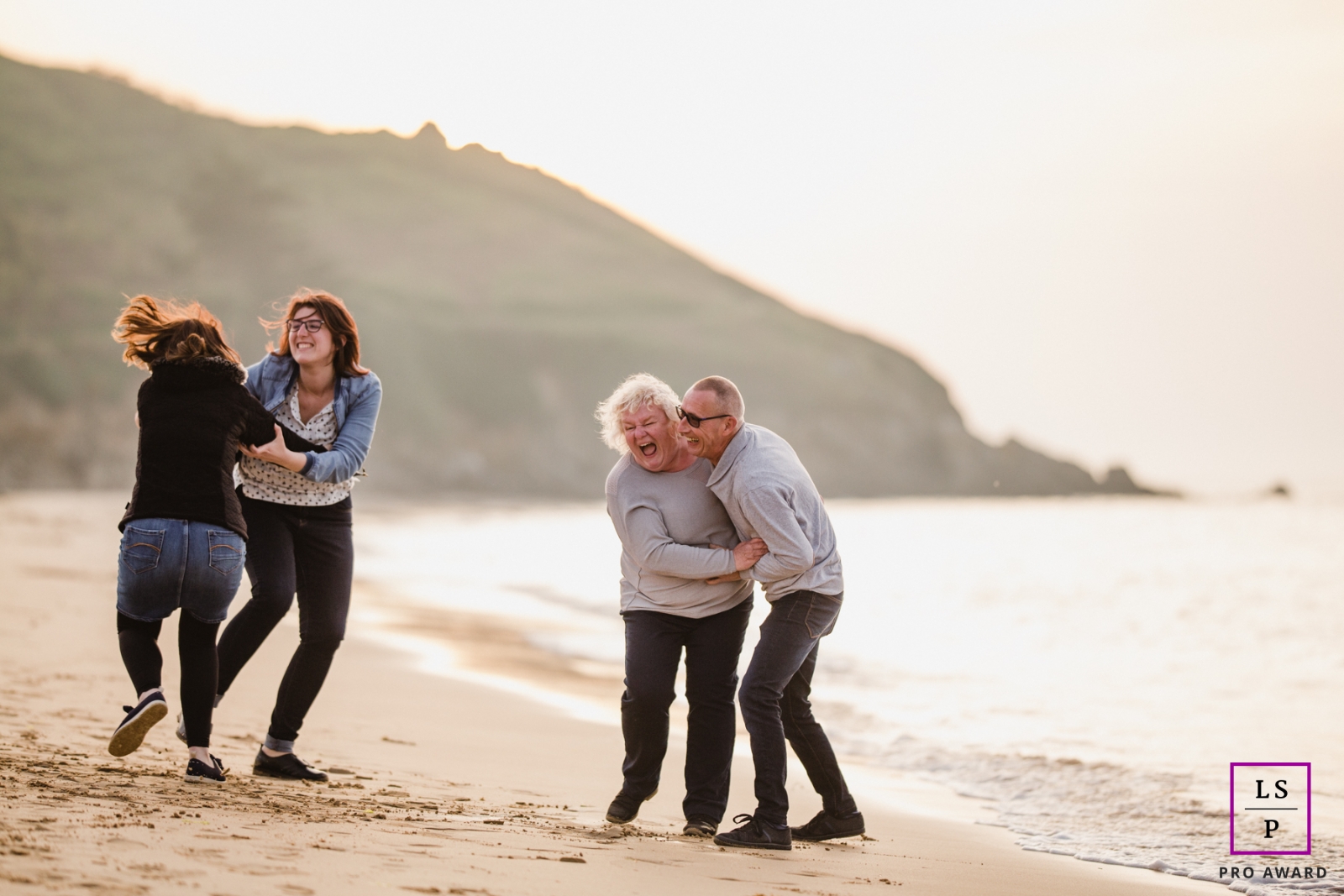 Mayenne Lifestyle Family Photography at the Beach | Image contains: Pays de la Loire, water, sand, couple, kids, laughing, playing