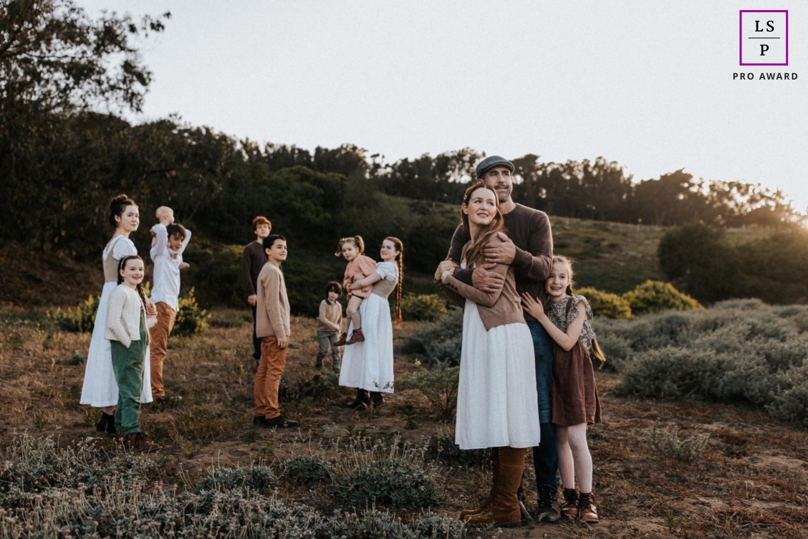 A modern Portland lifestyle photography session that documented a Family of 10 kids out with parents enjoying the low afternoon sunlight outdoors