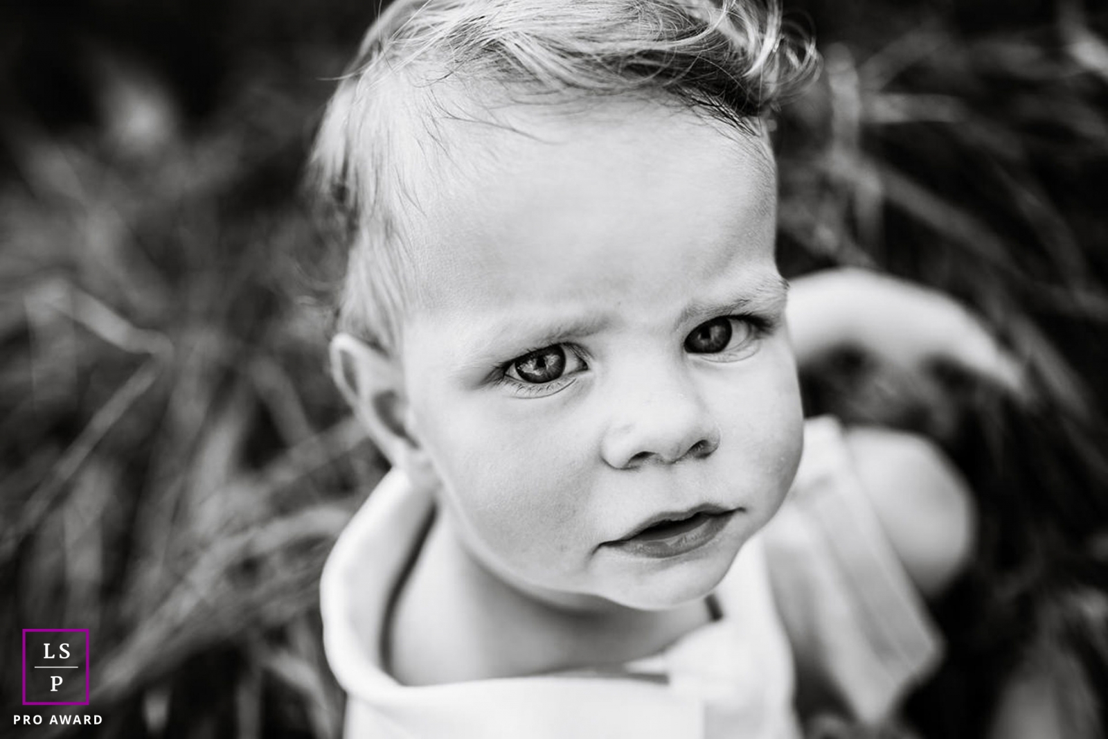 Family Photographer in Bourgogne-Franche-Comte France | Lifestyle Image contains: boy, black and white, close-up, portrait