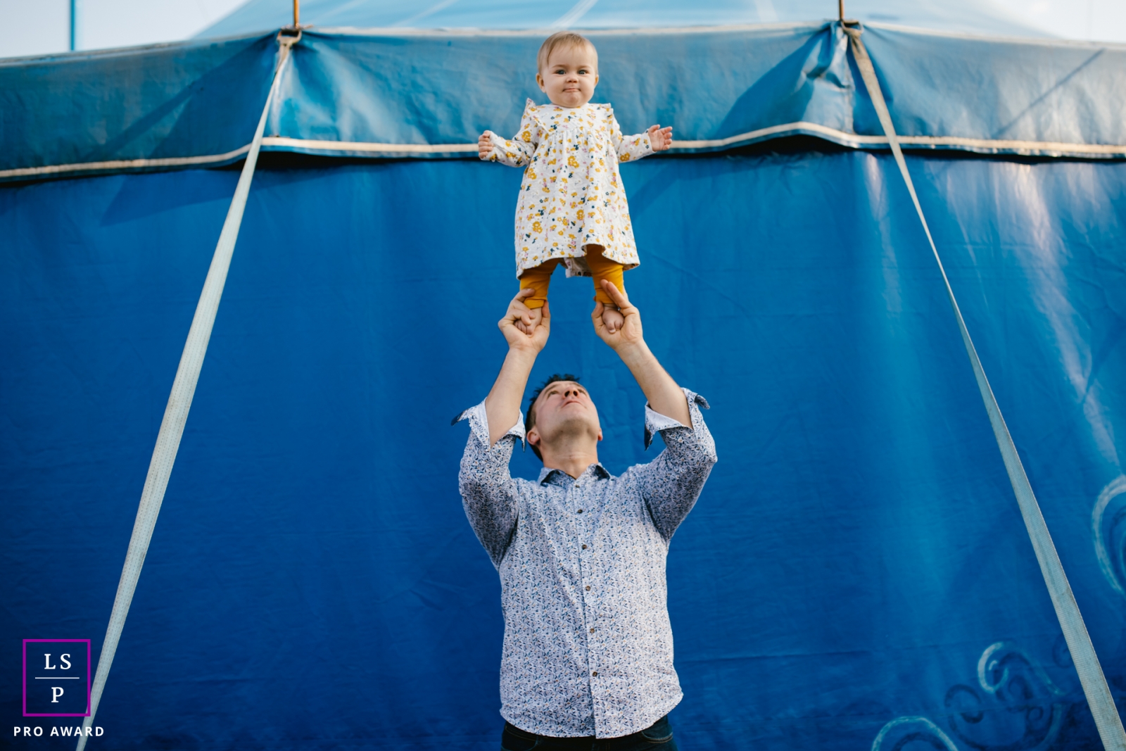 Artistic Doubs Lifestyle Photography showing some acrobatics at the circus with dad