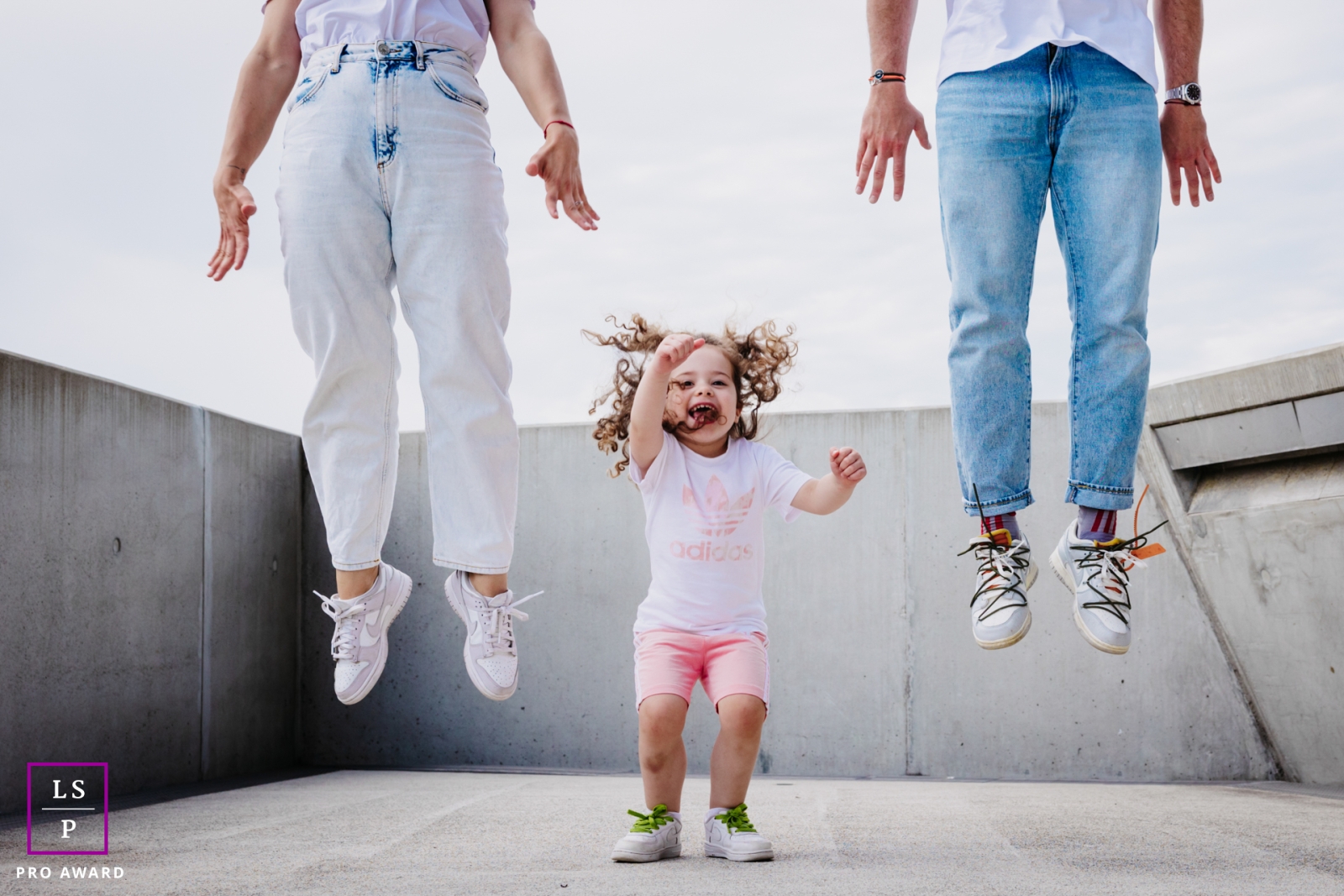 Lifestyle photography from France to show the urban family jump on a concrete pad