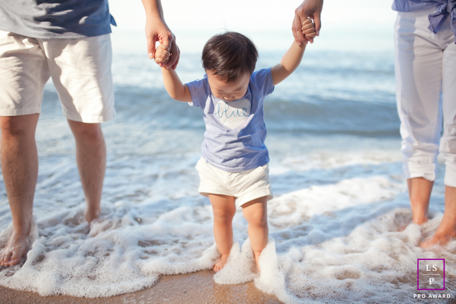 Malacca Lifestyle Family Portrait Session Malaysia | Photo contains: mom, dad, son, ocean, waves, sand, shoreline