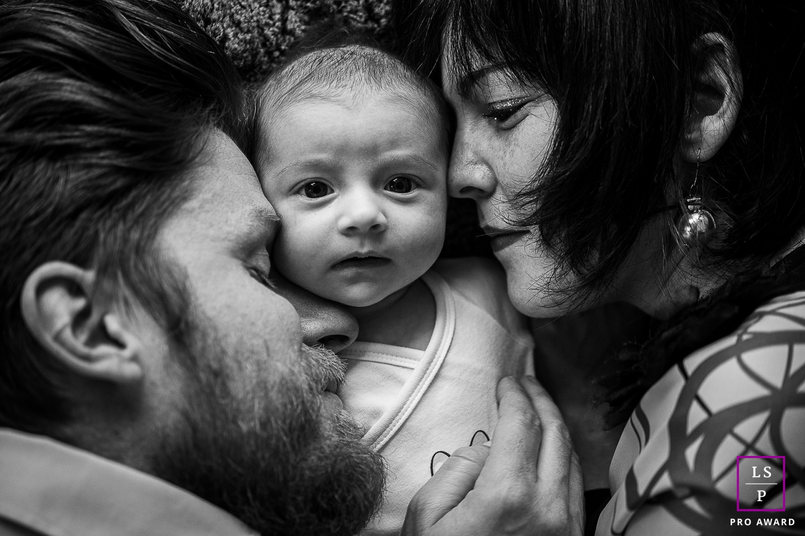 Savoie close-up on the faces of a baby and his 2 parents during this Auvergne-Rhone-Alpes family portrait session
